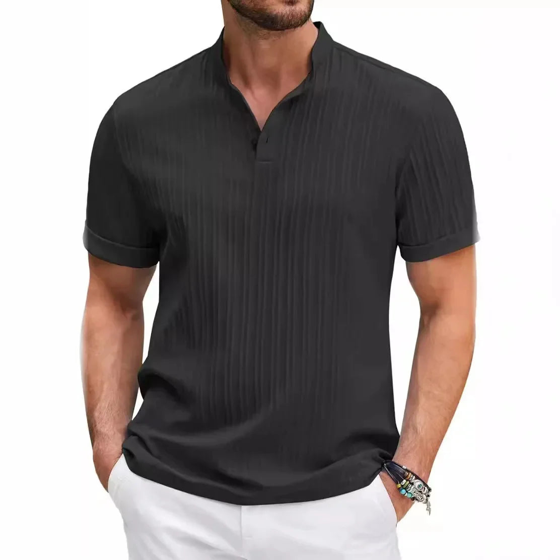 Man wearing a dark gray short-sleeve collared shirt with subtle vertical stripes, paired with white pants.