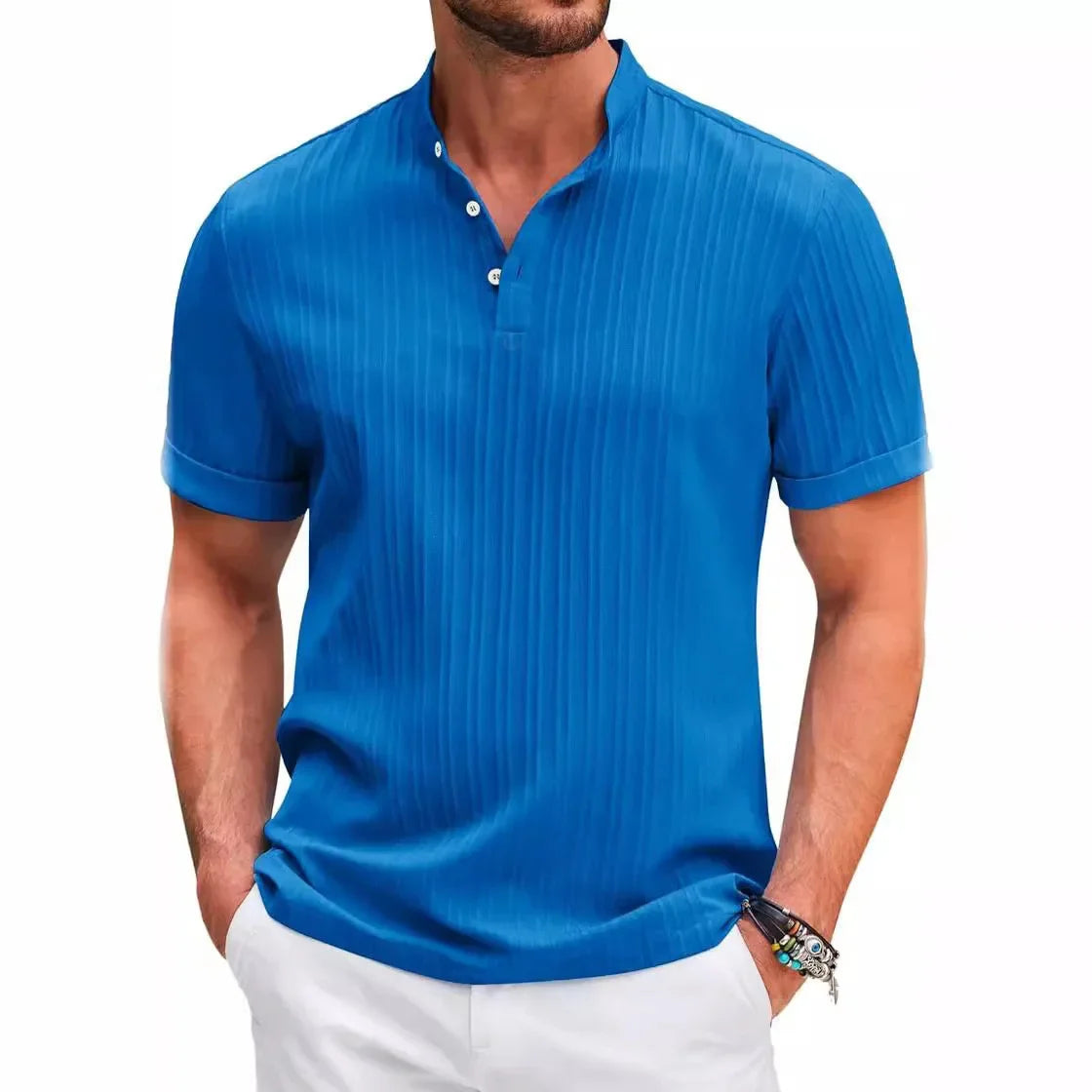 Man wearing a short-sleeved blue polo shirt with textured vertical stripes, white buttons, and a band collar, paired with white pants.
