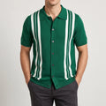 Man wearing a knitted short-sleeve green button-up shirt with prominent white vertical stripes and dark buttons.