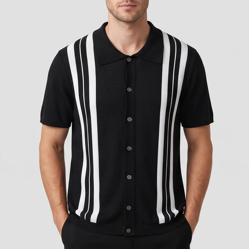 Man wearing a short sleeve knitted black button-up shirt with prominent white vertical stripes and dark buttons.