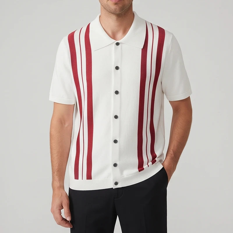 Man wearing a white knit short sleeve button-up shirt with bold red vertical stripes and dark buttons, against a gray background.