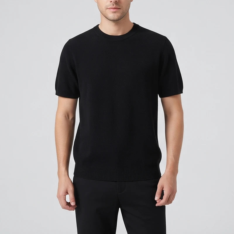 Black sweater on an off-gray studio background