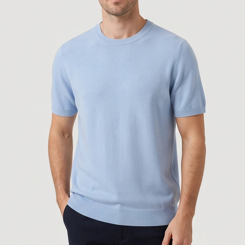 Blue sweater on an off-gray studio background