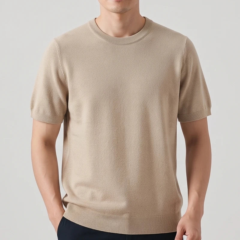 Camel sweater on an off-gray studio background