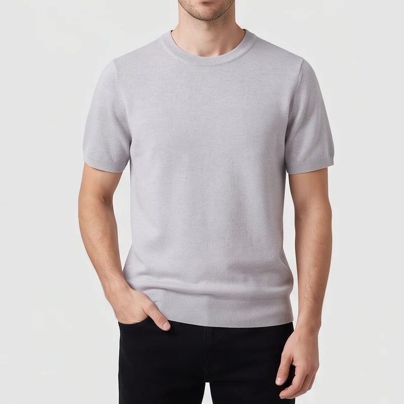 Gray sweater on an off-gray studio background