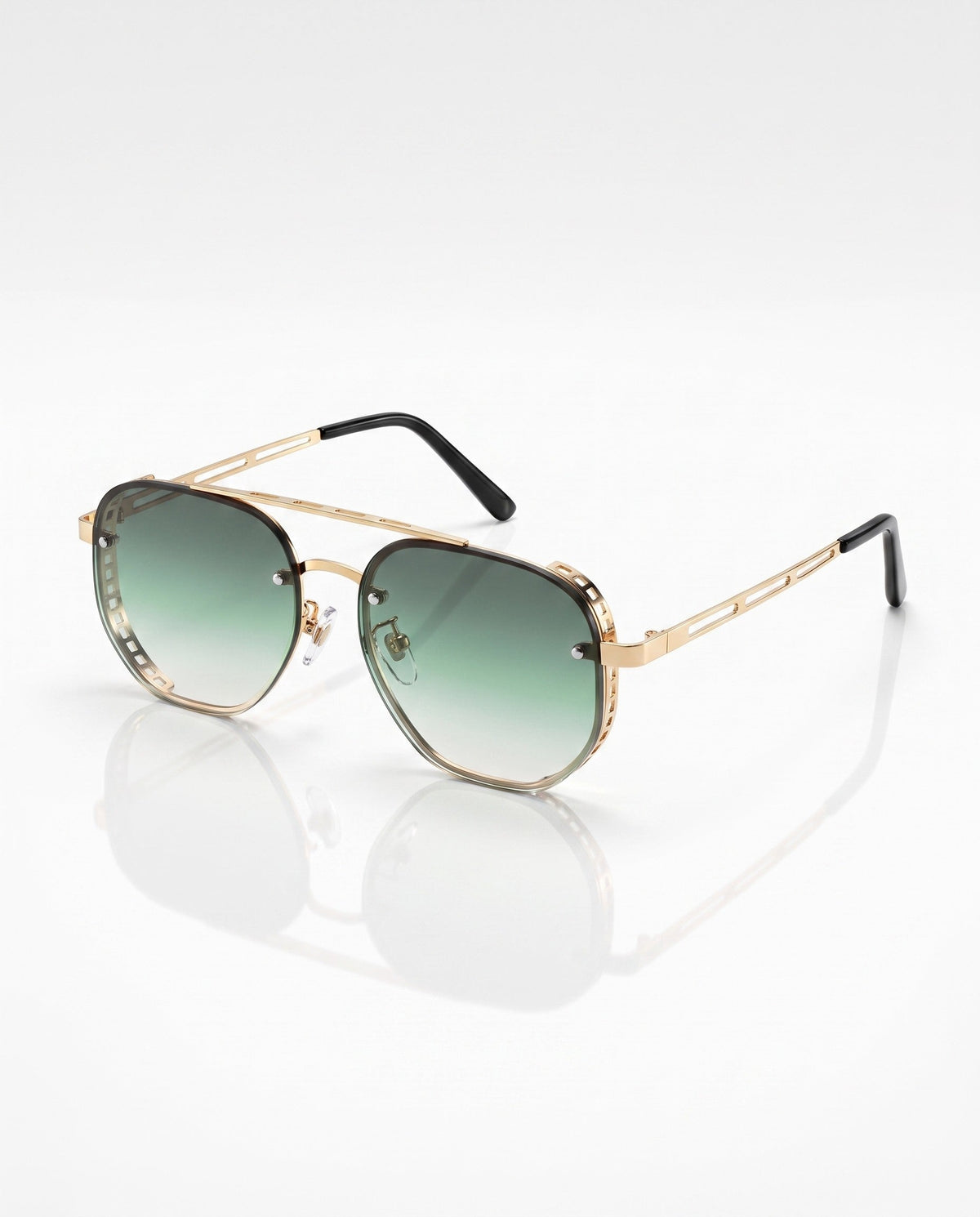 Gold-toned hexagonal frame sunglasses with green gradient lenses and black temple tips, shot on a white surface.