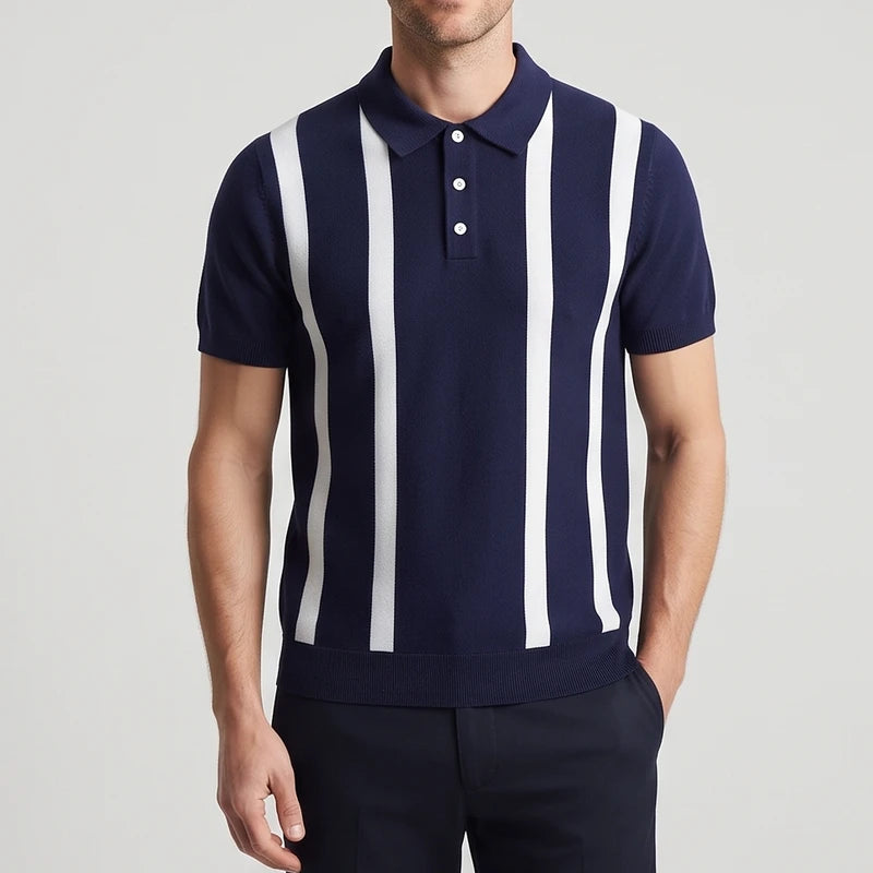 Blue knitted polo on an off-gray studio background