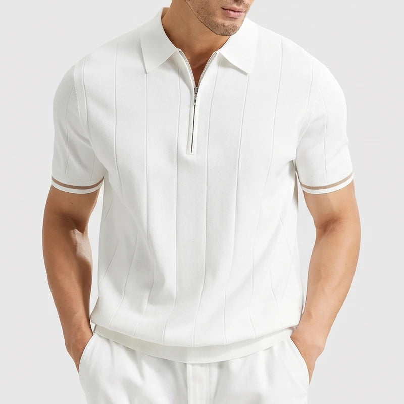 White knitted polo on an off-gray studio background
