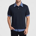 Blue polo on an off-gray studio background